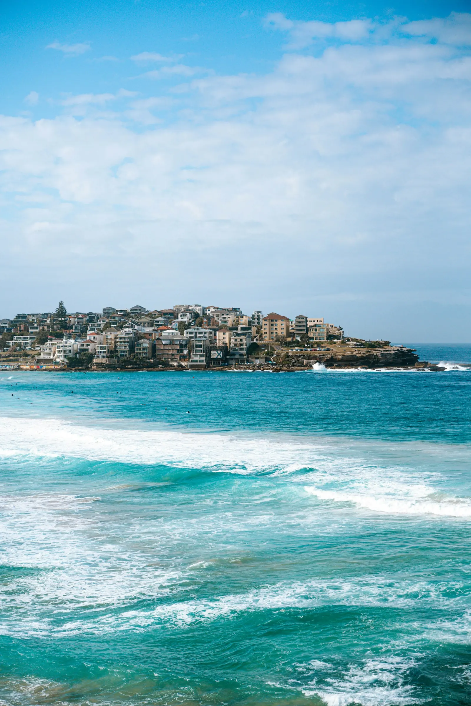 Houses on the North Bondi headland above the surf